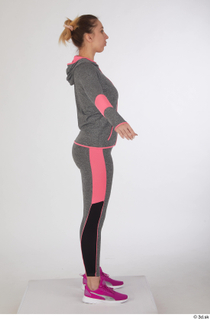 Mia Brown a poses dressed grey hoodie grey leggings pink…